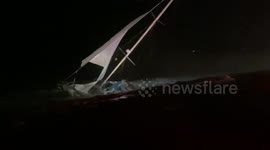 Cleanup in Newport Beach after flooding causes sailboat to capsize