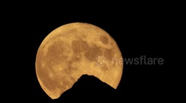 July's 'buck moon' rises over Dent Blanche mountain in Swiss Alps