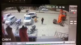 Moment generator plunges from crane narrowly missing passer-by in India