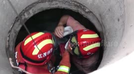 Firefighters rescue woman trapped in deep manhole in China