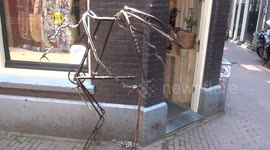 Dinosaur sculpture made from old cycle parts