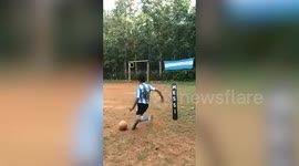 Boy lands perfect Messi-esque freekick through ring hung from goalpost in India