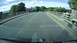 cyclist gets thrown off due to a vechile driver not looking and using a no right turn lane