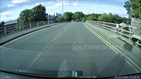 cyclist gets thrown off due to a vechile driver not looking and using a no right turn lane