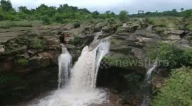 Waterfall overflows with water after heavy rainfall, floods lash western India's Gujarat