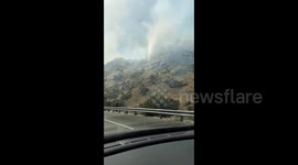 Firefighters battle flames in Simi Valley, California mountains