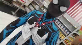 Spiderman fan visits supermarket in different superhero costumes