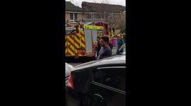 Firefighters and police on scene after crane crashes down onto house in London