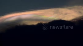 Stunning rainbow clouds form at sunset in the Philippines