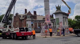 Construction crews dismantling Jefferson Davis Confederate Memorial in Richmond, Virginia