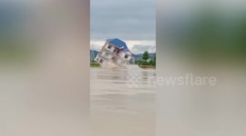 Buildings washed away by overflowing river due to heavy rain in southern China