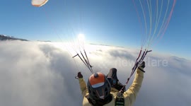 This stunning video shows an adrenaline junkie who filmed himself paragliding in the HEAVENS
