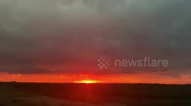 Amazing footage of golden sunset while lightning storm rages nearby in South Dakota