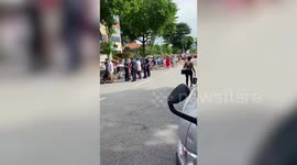 Long line of voters seen queuing at polling station in Singapore