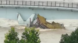 Chinese pleasure boat collapses after crashing into bridge pier during massive flooding