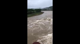 Japan floods: Pounding rain swells river in Hita, Oita Prefecture