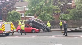 Car driver crashes under another vehicle in Birmingham, UK