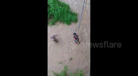 Indian rescuers haul stranded fishermen to safety from severe flooding