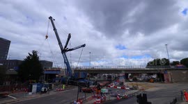Timelapse of 750 tonne crane lifting sections of bridge, during demolition in Leeds