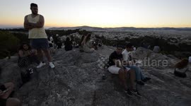Tourists underneath the Acropolis in Athens Greece
