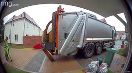 Amusing moment bungling UK bin men reverse into wooden posts