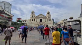 Devotees in the Philippines attend mass outside church as capacity limited to 10%