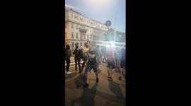 Protesters applaud police officers chasing unarmed people to make them feel ashamed of themselves in Belgrade, Serbia