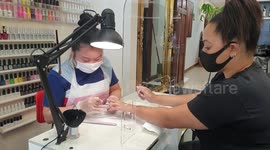 Beauty and nail salons in England reopen for the first time in three months