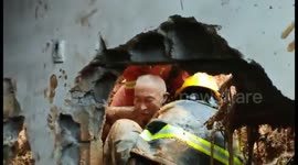 Firefighters rescue elderly man buried in mud after landslide hits southern China