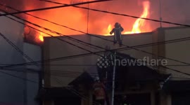 Firefighters battle blaze at market in Padang, Indonesia