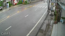 Driver survives after skidding on wet road being flung through door window