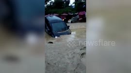 Ten dead and dozens more missing as flash floods hit Indonesia