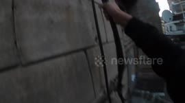 This stunning footage shows a daredevil roof topper a building and it’s pillar that features a star