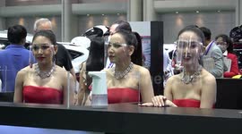 Thai models don face shields at first motor show amid COVID-19 pandemic