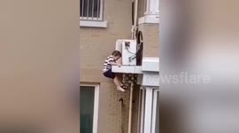 Chinese man catches toddler falling from fourth floor of residential building