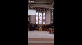 Priest does blinding light dance in church
