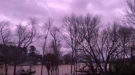 Surreal stormy purple sky spotted over lake in the US
