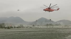 World's biggest helicopter used to drop stones to prevent dam break in China
