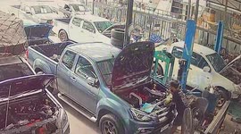 Pickup truck hood falls crushing mechanic's bowl of noodles