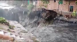 Two-story building comes crashing down after heavy rain lashes Indian capital