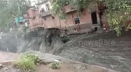 Further footage: Two-storey building comes crashing down after heavy rain lashes Indian capital