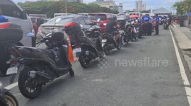 Dozens of motorcyclists queue to receive COVID-19 test in the Philippines