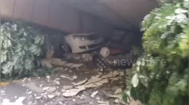 Firefighters rescued man trapped in car after wall collapses due to heavy rain