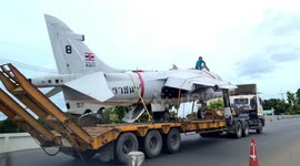 Retired fighter transported along road to be displayed in Thailand
