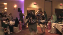 A throwback just in time for the NFL season: Bride and groom fuse Indian, Pakistani culture with Ravens-themed wedding entrance