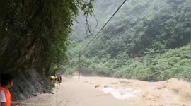 Police rescue family trapped in flood with 300 metre rope