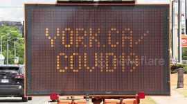 Signs on city streets in Markham Canada reminding people to be COVID 19 safe and wear a mask as the coronavirus pandemic drags on