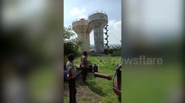 Dramatic footage shows dilapidated tank posing major threat to residents being demolished in western India