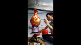 Vietnamese potter decorate the pottery with beautiful pictures
