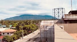 Breathtaking mass of white clouds flow over mountain in the Philippines
